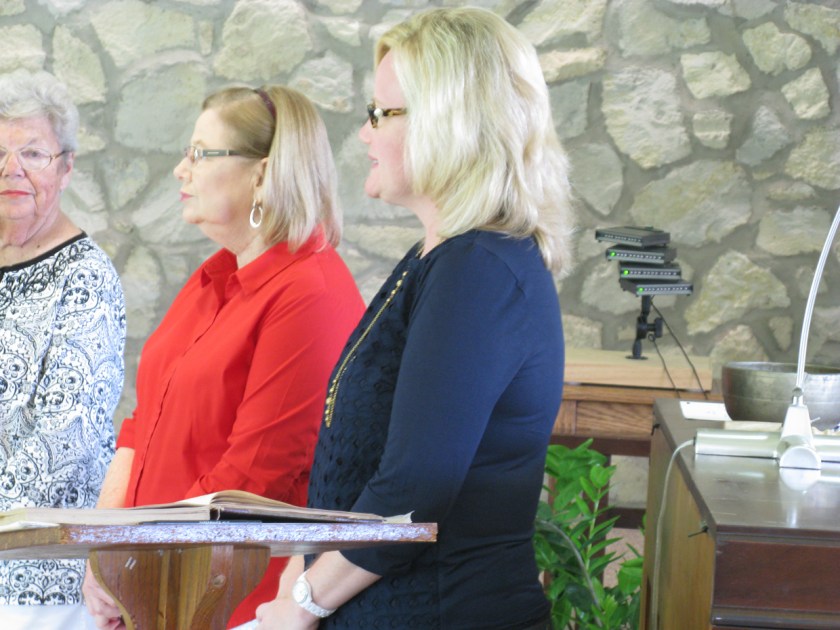 New member, Patti Cooksey (center), and her sponsor, Dana Cosper (right)
