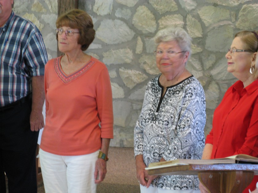 New member, Lucille Ruga (second from left) and her sponsor, Vita Uth (third from left)